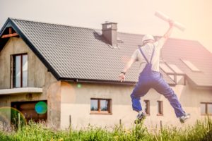 A man standing in front of the house